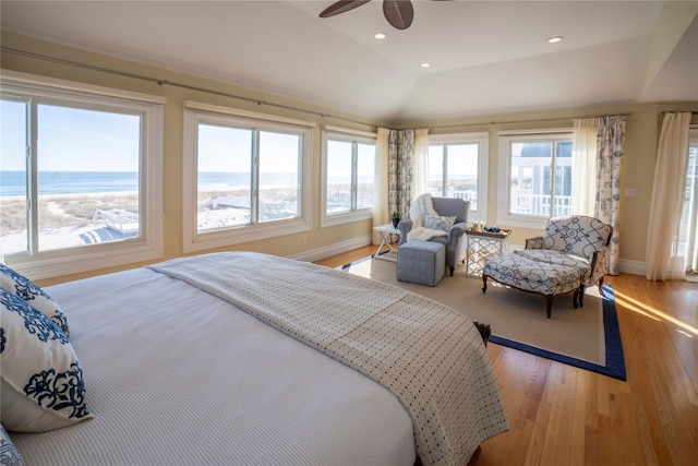 bedroom with baseboards, light wood-type flooring, vaulted ceiling, recessed lighting, and a ceiling fan