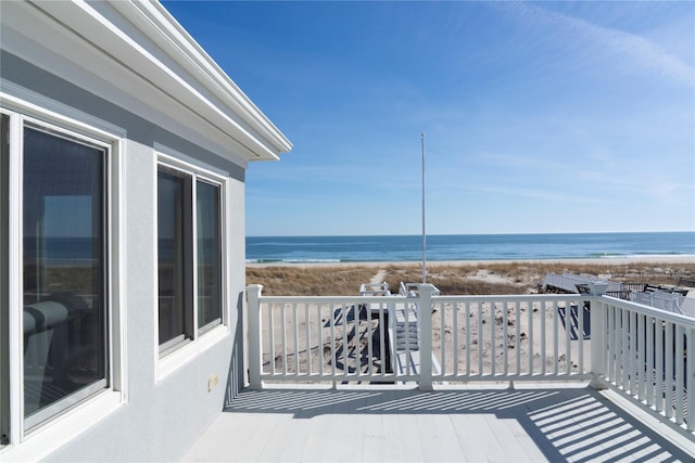 exterior space with a beach view and a water view