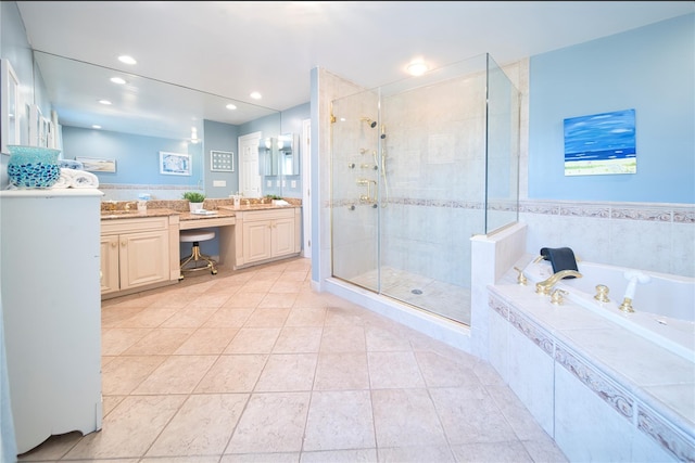 bathroom featuring tile patterned flooring, a shower stall, a garden tub, recessed lighting, and vanity