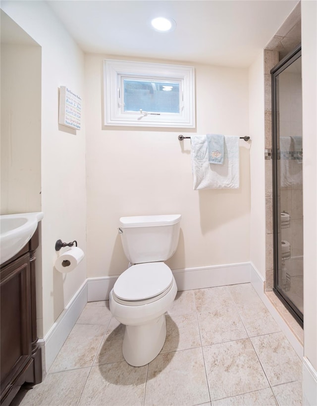 full bathroom with vanity, tile patterned floors, toilet, and a stall shower