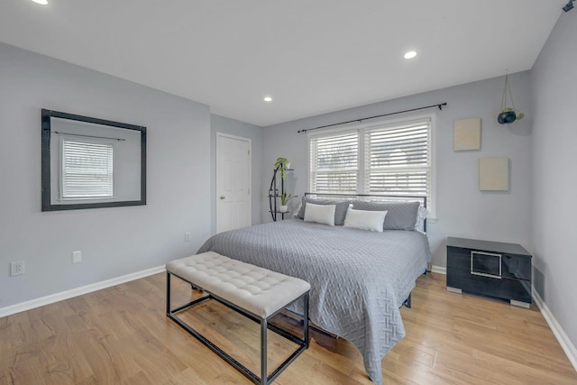 bedroom featuring recessed lighting, baseboards, and light wood-type flooring