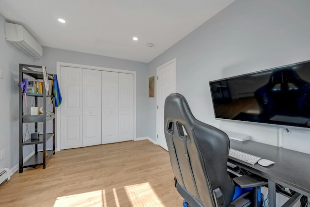 office area with baseboards, a wall unit AC, recessed lighting, light wood-style floors, and a baseboard radiator