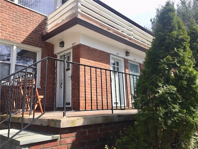 view of property exterior with brick siding