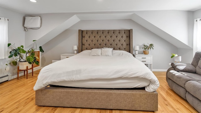 bedroom with recessed lighting, baseboards, light wood-style floors, and vaulted ceiling