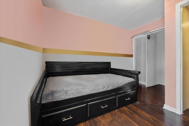 bedroom featuring dark wood-type flooring