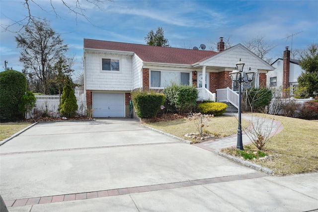 view of front of property featuring concrete driveway, an attached garage, fence, and brick siding