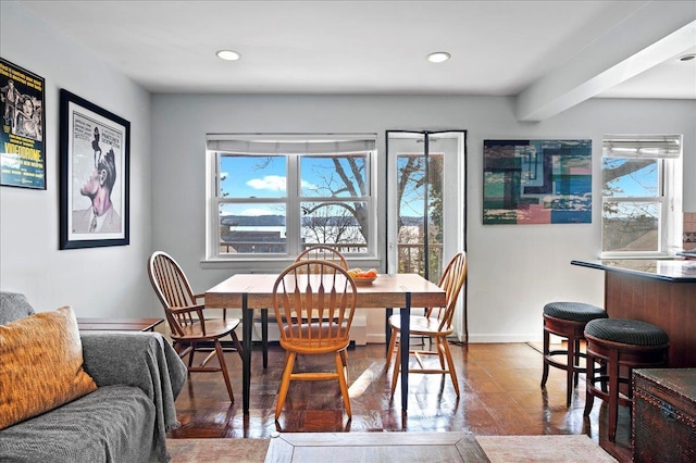 dining area with recessed lighting, a healthy amount of sunlight, and baseboards