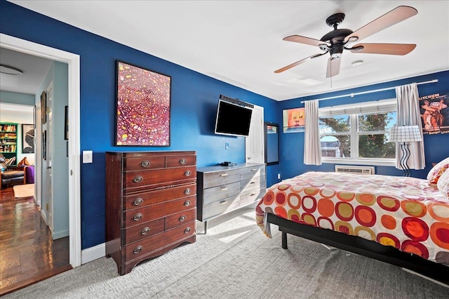 bedroom with baseboards, carpet floors, and a ceiling fan