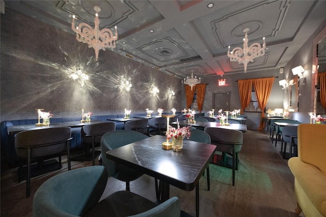 dining area with beamed ceiling, coffered ceiling, and an inviting chandelier