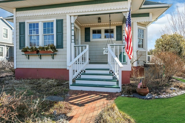 doorway to property with covered porch