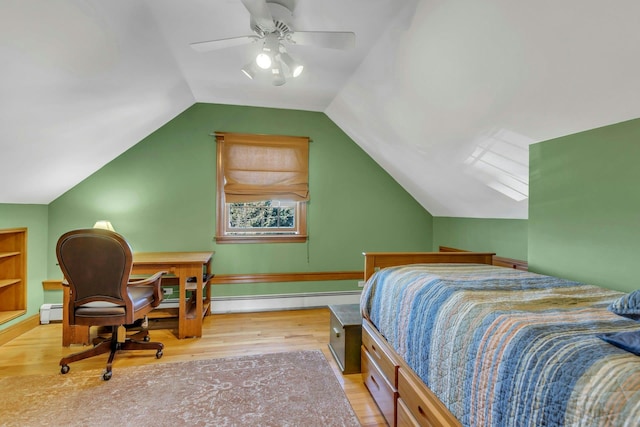 bedroom featuring baseboards, lofted ceiling, wood finished floors, a ceiling fan, and a baseboard radiator