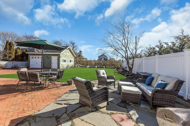 view of patio / terrace featuring an outdoor living space, an outdoor structure, and a fenced backyard