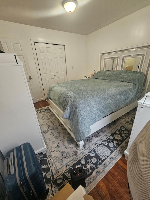 bedroom featuring a closet and wood finished floors