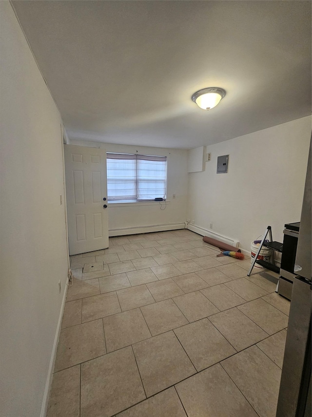 unfurnished room with light tile patterned floors, electric panel, and baseboards