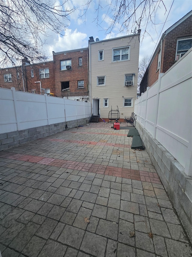 view of patio featuring a fenced backyard and entry steps