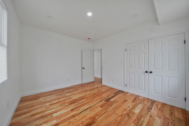 139-19 230th St, Laurelton, NY 11413 - unfurnished bedroom with light wood-style flooring, a closet, and baseboards