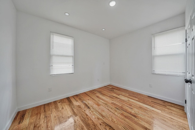 139-19 230th St, Laurelton, NY 11413 - unfurnished room featuring light wood finished floors, baseboards, and a healthy amount of sunlight