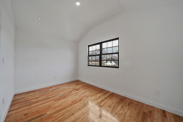 139-19 230th St, Laurelton, NY 11413 - empty room with light wood-style flooring, recessed lighting, vaulted ceiling, and baseboards