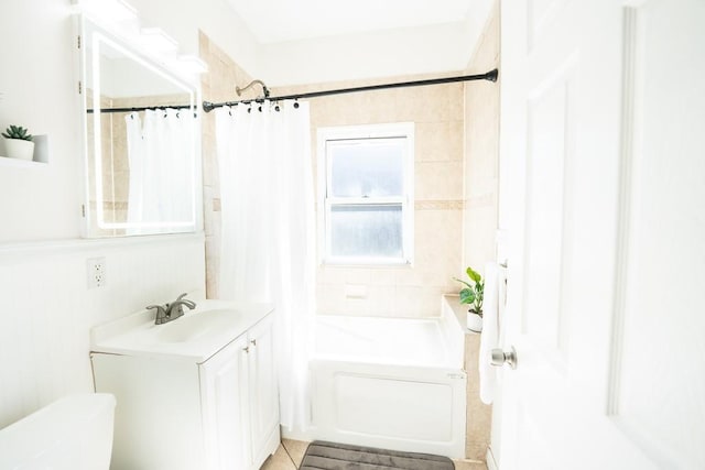 bathroom with vanity, shower / bath combination with curtain, toilet, and tile patterned flooring