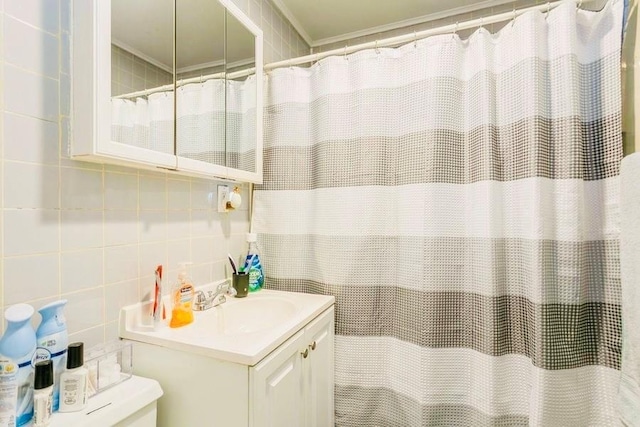 bathroom featuring decorative backsplash, tile walls, vanity, and a shower with shower curtain