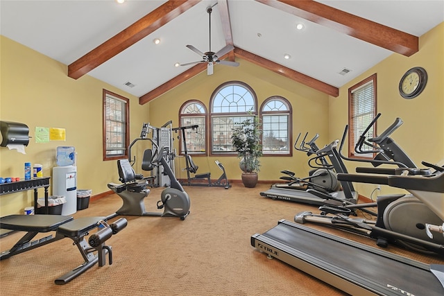 exercise room featuring vaulted ceiling, baseboards, visible vents, and ceiling fan