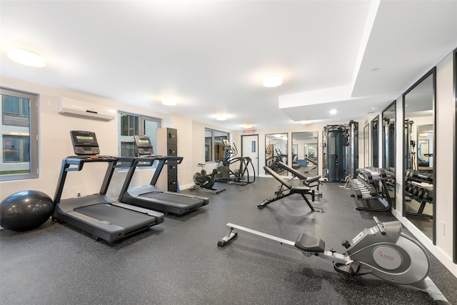 exercise room with a wall unit AC