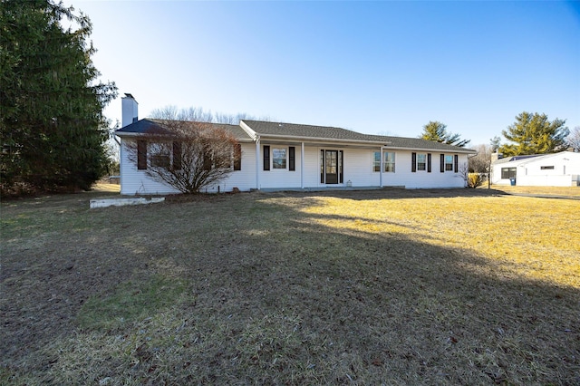 single story home featuring a front yard and a chimney