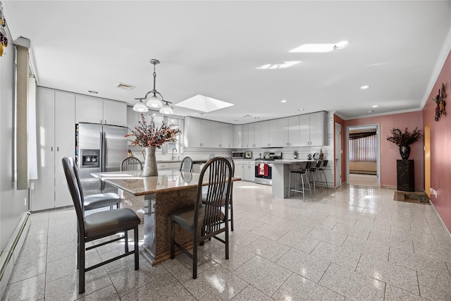 dining room featuring recessed lighting, a baseboard radiator, baseboards, and granite finish floor