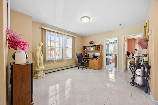 office space featuring a wealth of natural light, a baseboard heating unit, baseboards, and light tile patterned floors