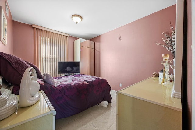 bedroom featuring light tile patterned floors