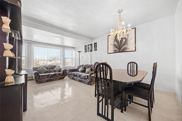 dining space featuring an inviting chandelier