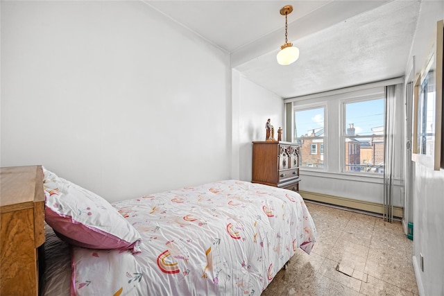 bedroom featuring a baseboard heating unit and light floors