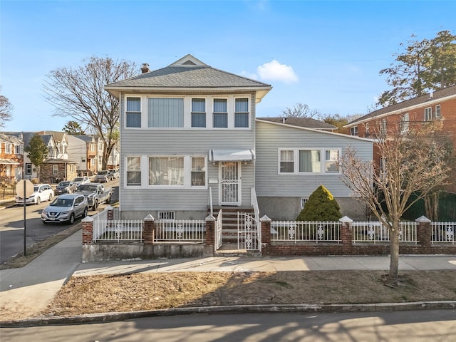 view of front facade with a fenced front yard