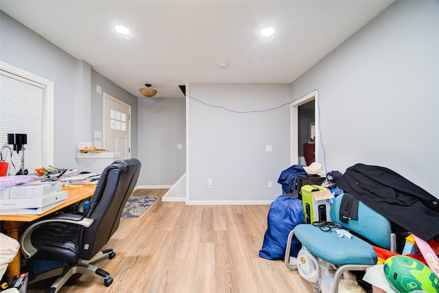 home office featuring baseboards and light wood-style floors