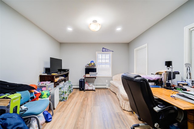 office area featuring recessed lighting, light wood-style flooring, and a baseboard heating unit