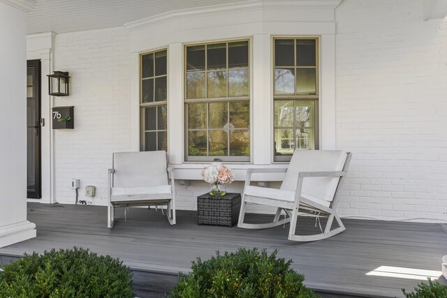 wooden terrace with a porch