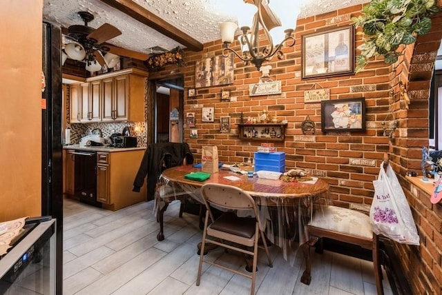 dining room with beamed ceiling, a textured ceiling, light wood-style floors, and ceiling fan