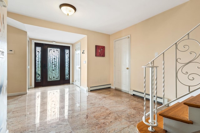 entryway with stairs, a baseboard heating unit, and baseboards