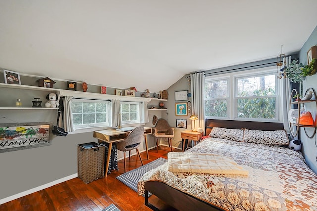 bedroom featuring vaulted ceiling, baseboards, and hardwood / wood-style flooring