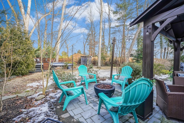 view of patio / terrace with an outdoor fire pit