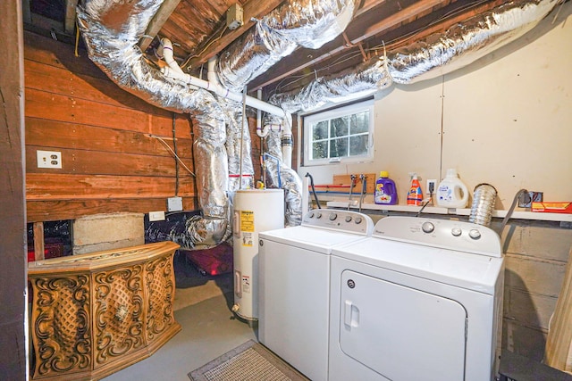 washroom with washer and dryer and water heater