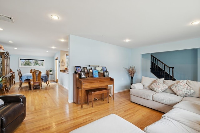 living room with recessed lighting and light wood-style floors