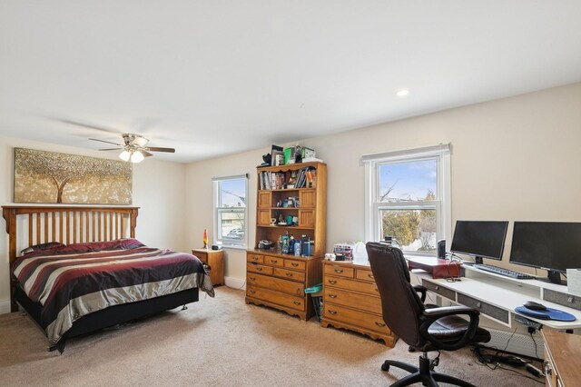 bedroom with light carpet, recessed lighting, and a ceiling fan