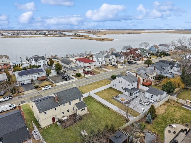 aerial view with a residential view and a water view