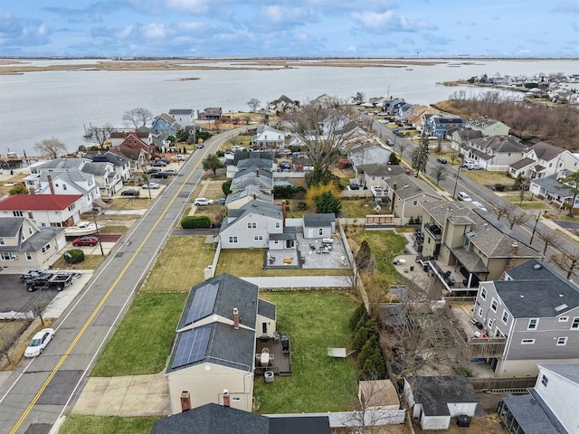 bird's eye view featuring a residential view and a water view