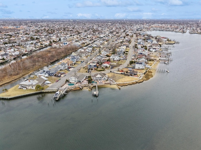 bird's eye view with a residential view and a water view