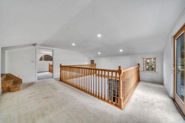 additional living space with carpet floors, recessed lighting, and vaulted ceiling