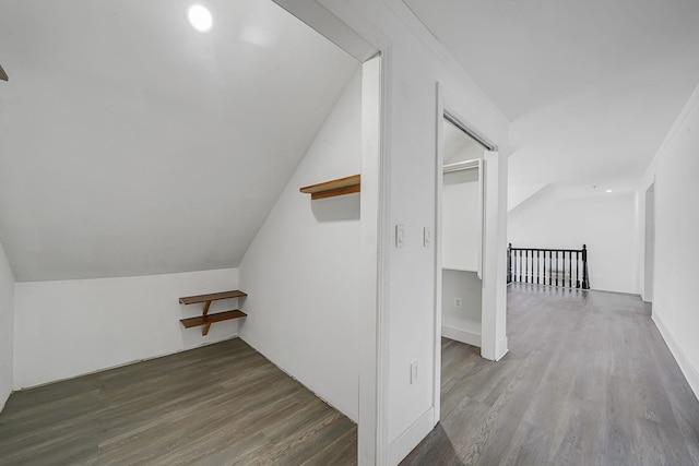 bonus room with lofted ceiling and wood finished floors