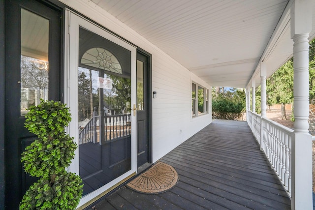 wooden terrace featuring a porch