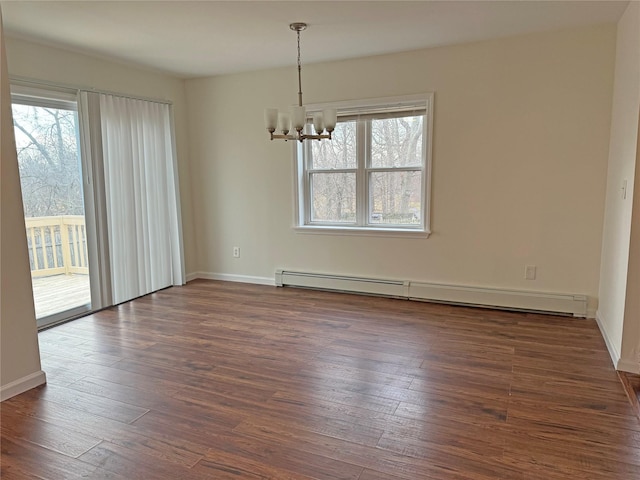 unfurnished room featuring a notable chandelier, dark wood-style flooring, baseboards, and a baseboard radiator